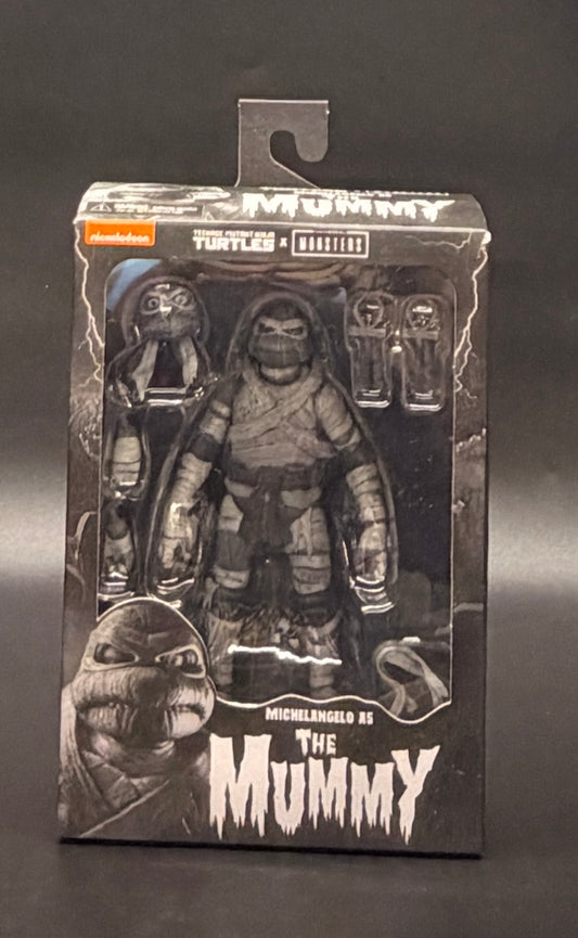The Mummy (Michelangelo) Teenage Mutant Ninja Turtles X Universal Monsters (Black and White Variant) Action Figure NECA 2025