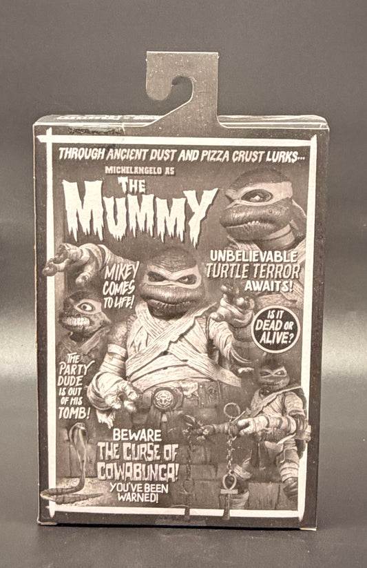 The Mummy (Michelangelo) Teenage Mutant Ninja Turtles X Universal Monsters (Black and White Variant) Action Figure NECA 2025